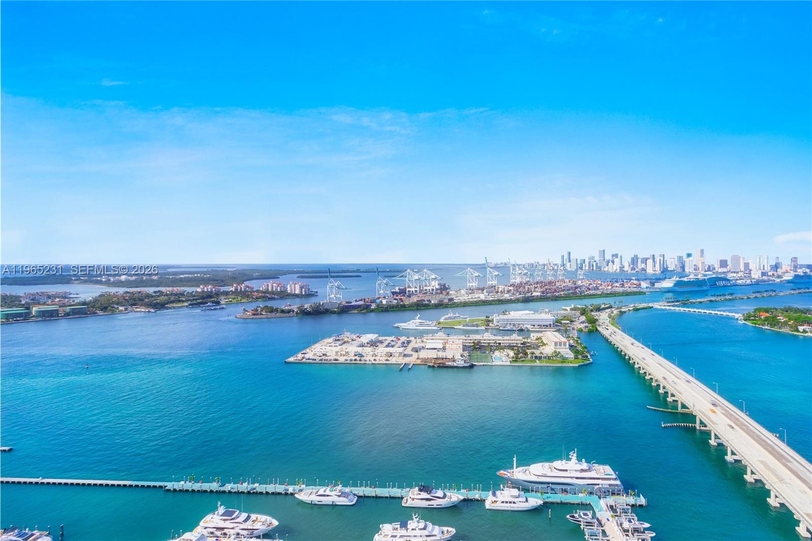 450 Alton Road, Unit 3703 Miami Beach, FL 33139 - Photo 16 of 27 a view of a lake with houses