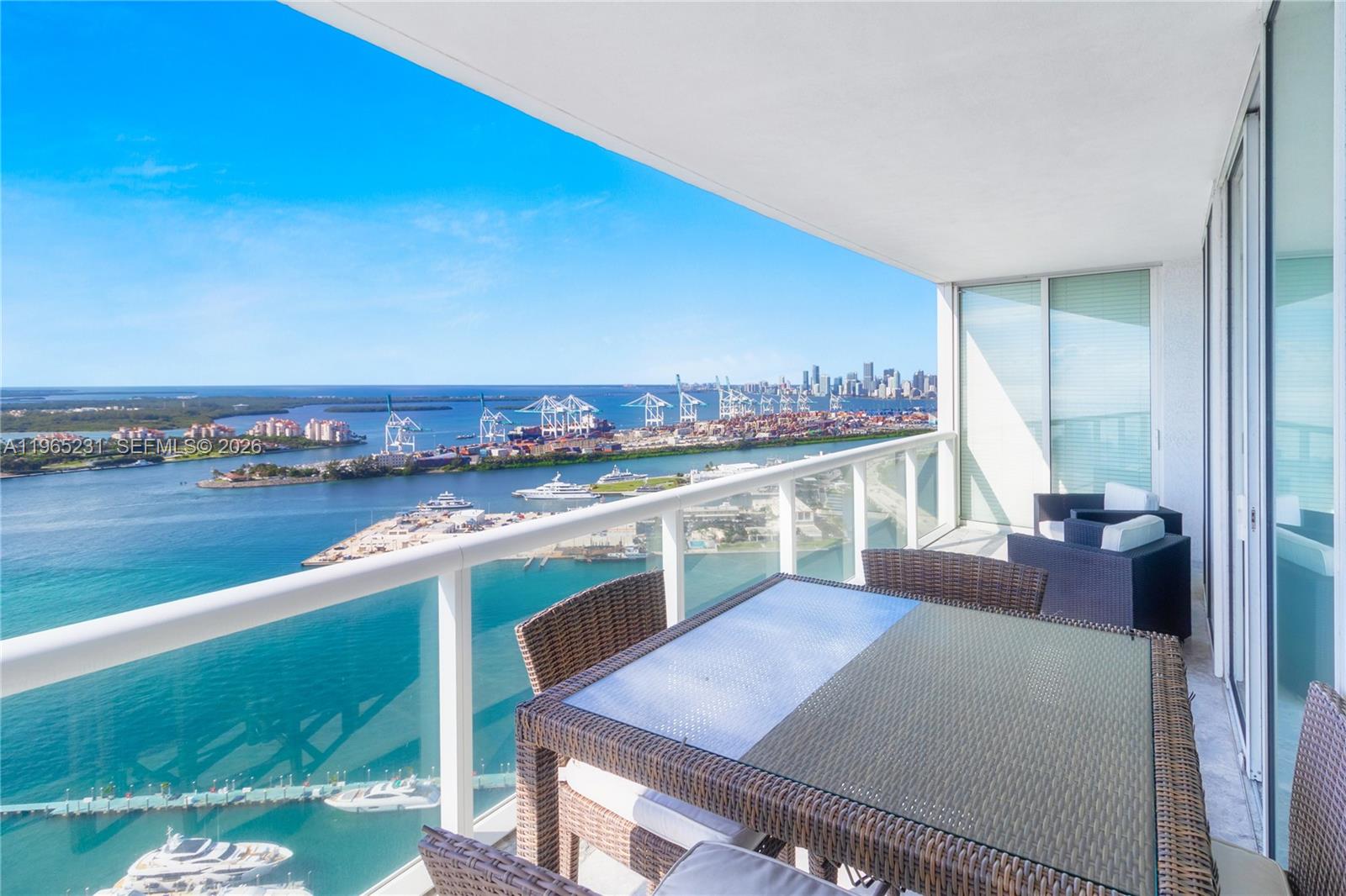 450 Alton Road, Unit 3703 Miami Beach, FL 33139 - Photo 24 of 27 a view of a living room and dining room