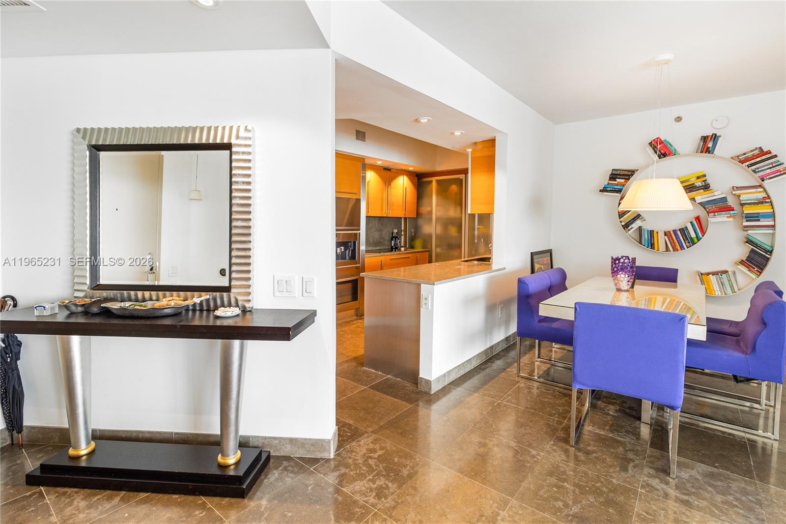 450 Alton Road, Unit 3703 Miami Beach, FL 33139 - Photo 6 of 27 a living room with furniture a flat screen tv and a window