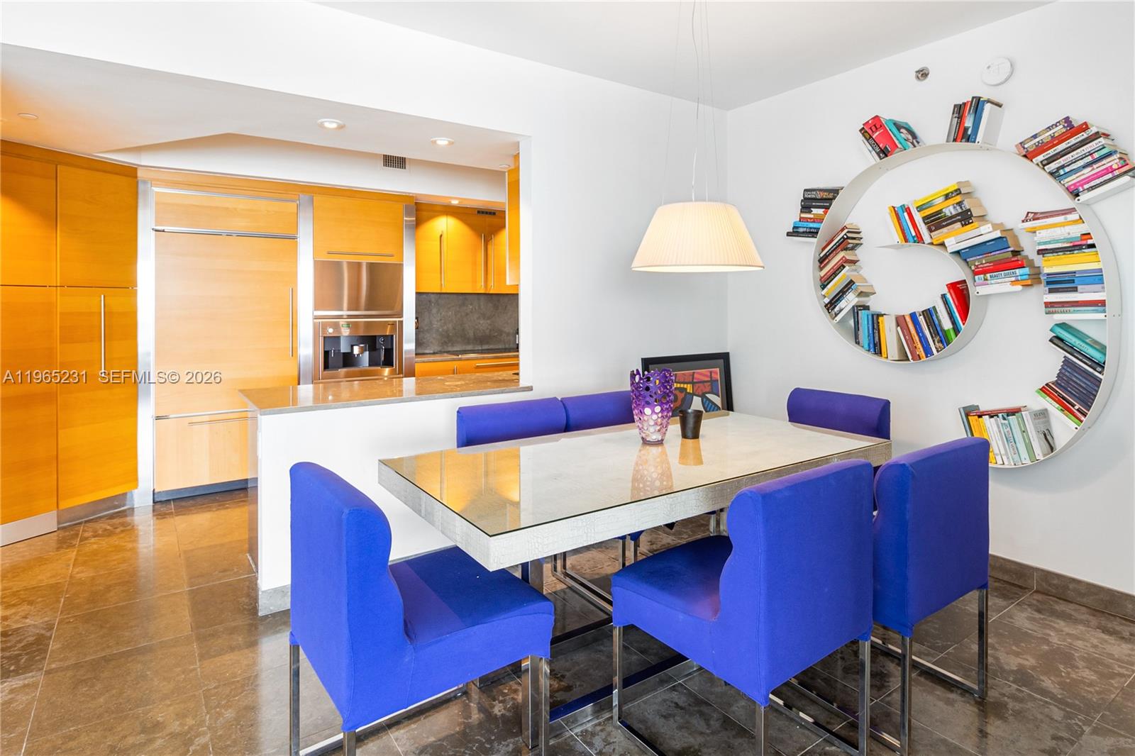 450 Alton Road, Unit 3703 Miami Beach, FL 33139 - Photo 7 of 27 a view of a dining room with furniture and a large window