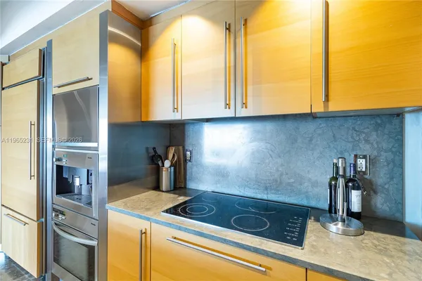 a kitchen with a sink and a refrigerator
