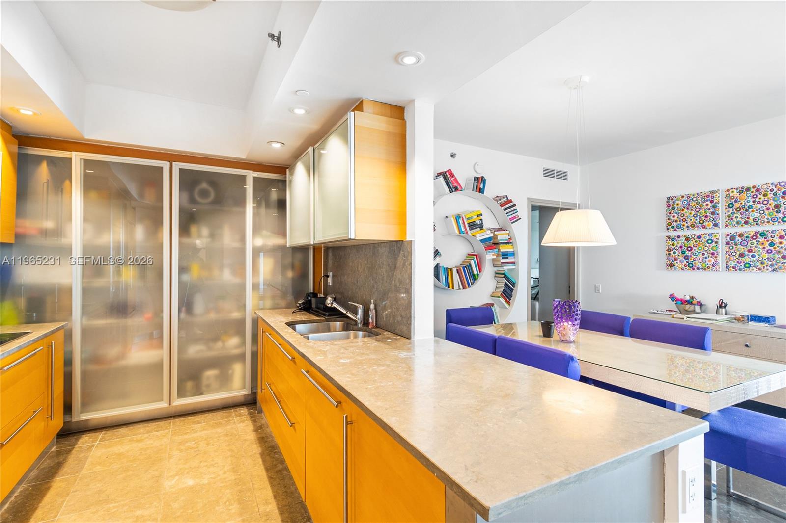 450 Alton Road, Unit 3703 Miami Beach, FL 33139 - Photo 10 of 27 a kitchen with stainless steel appliances granite countertop a sink and a refrigerator