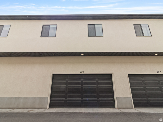 130 East 7085th South, Unit 3 Midvale, UT 84047 - Photo 26 of 30 View of front facade featuring stucco siding and an attached garage