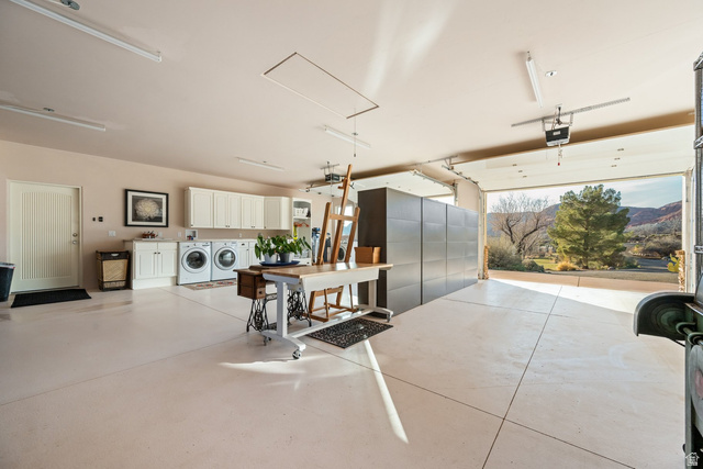 779 South Silver Road Leeds, UT 84746 - Photo 41 of 80 Garage with washer and dryer, a mountain view, and a garage door opener