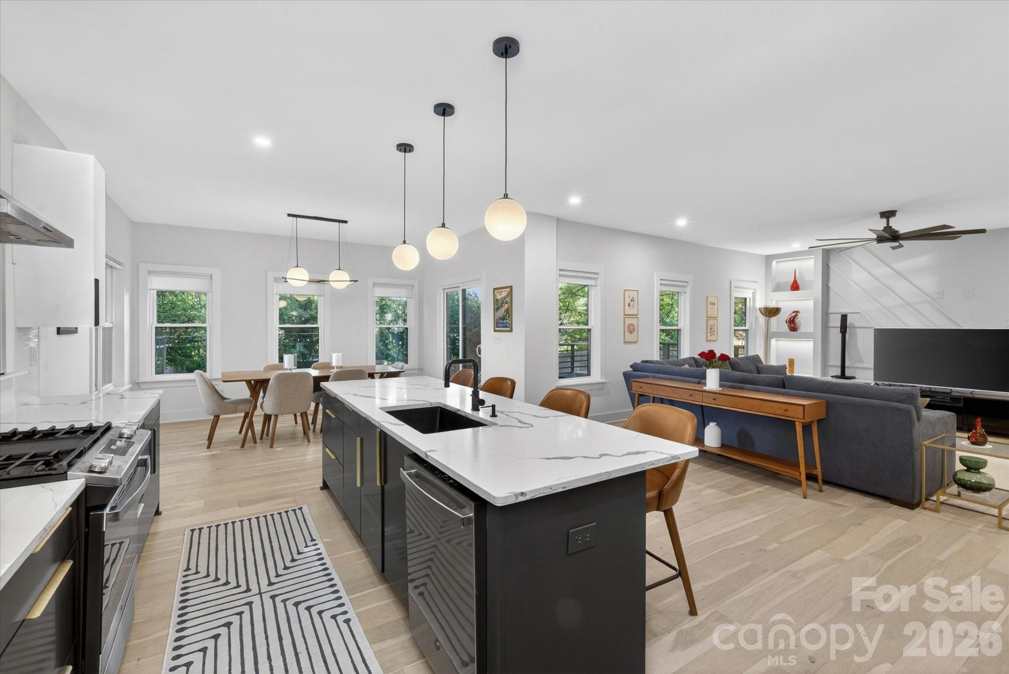 1608 Chippendale Road Charlotte, NC 28205 - Photo 27 of 46 a kitchen with a stove and a wooden floor
