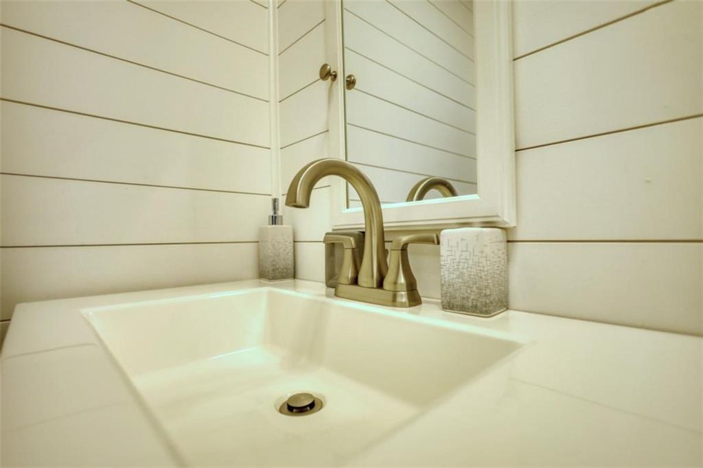 480 Friar Tuck Circle Covington, GA 30014 - Photo 16 of 56 a close view of a bathtub in a bathroom