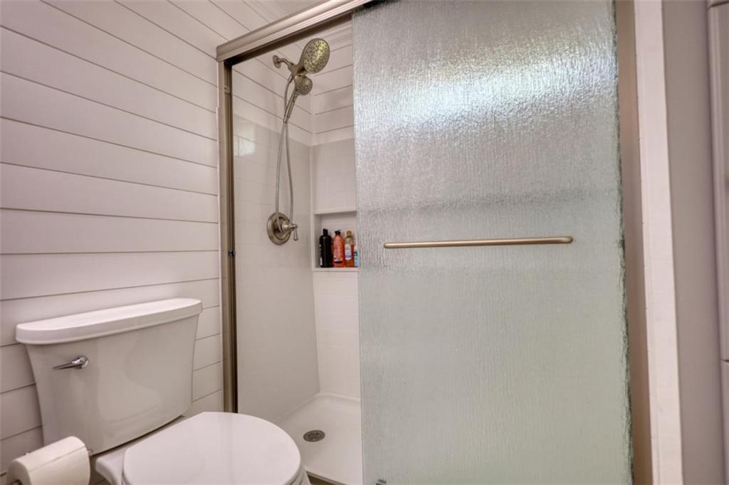 480 Friar Tuck Circle Covington, GA 30014 - Photo 22 of 56 a bathroom with a toilet and a shower