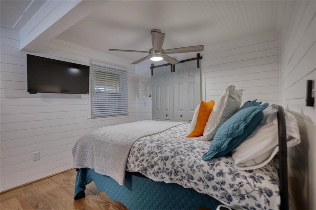 480 Friar Tuck Circle Covington, GA 30014 - Photo 23 of 56 a bedroom with a bed and a television