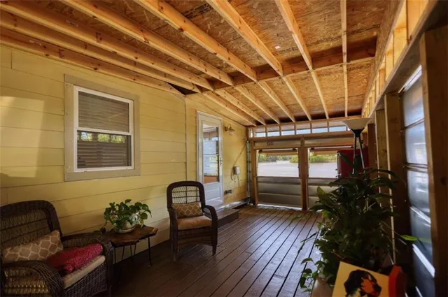a view of a chairs in wooden deck