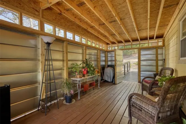 a view of a house with backyard and trees