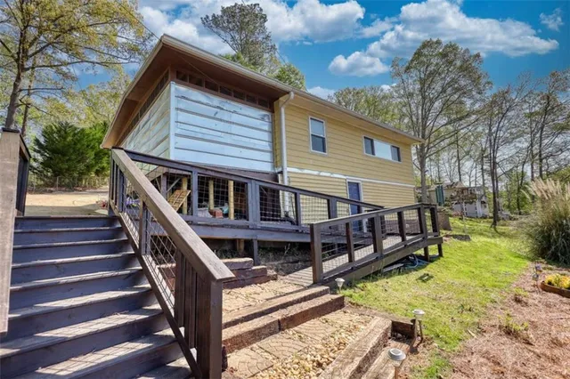 a view of a balcony with wooden floor