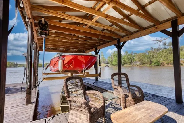 an aerial view of a house with a lake view