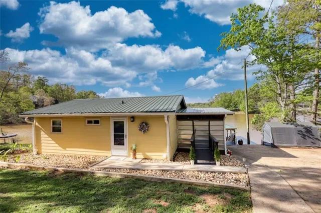 a view of a dining room with furniture and window