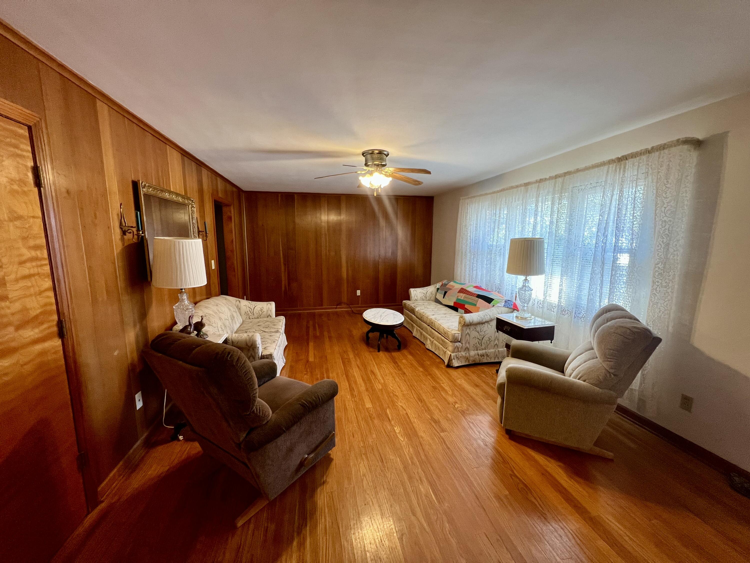 307 Virginia Mineral Springs Road New Castle, VA 24127 - Photo 11 of 45 a living room with furniture and wooden floor