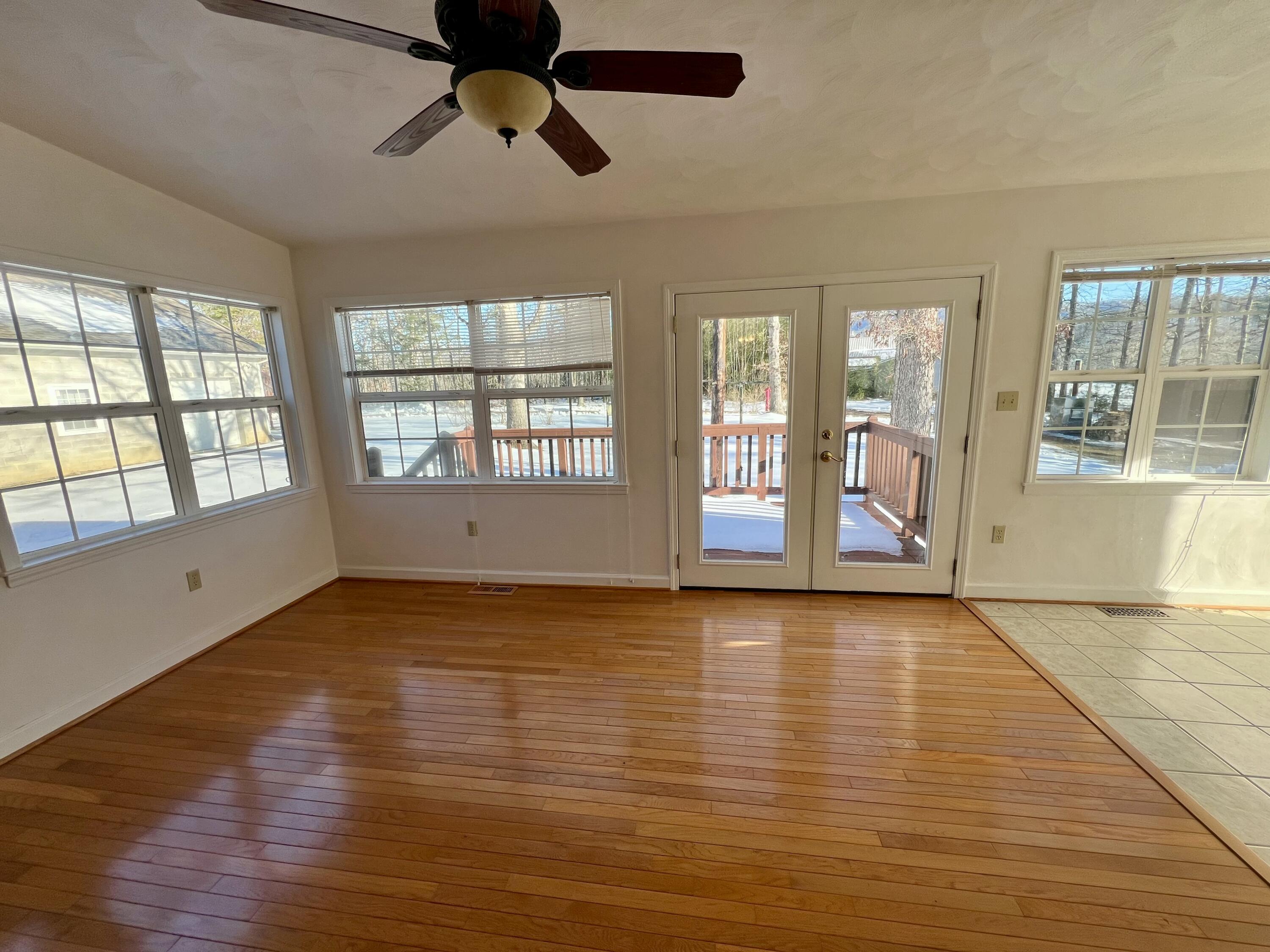 307 Virginia Mineral Springs Road New Castle, VA 24127 - Photo 15 of 45 a view of an empty room with wooden floor and a window