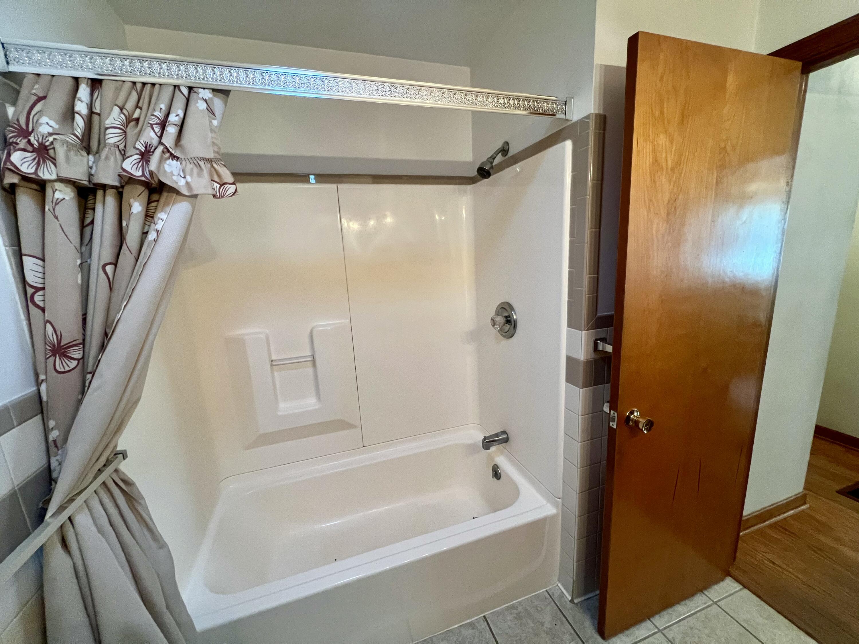 307 Virginia Mineral Springs Road New Castle, VA 24127 - Photo 20 of 45 a bathroom with a shower and a tub
