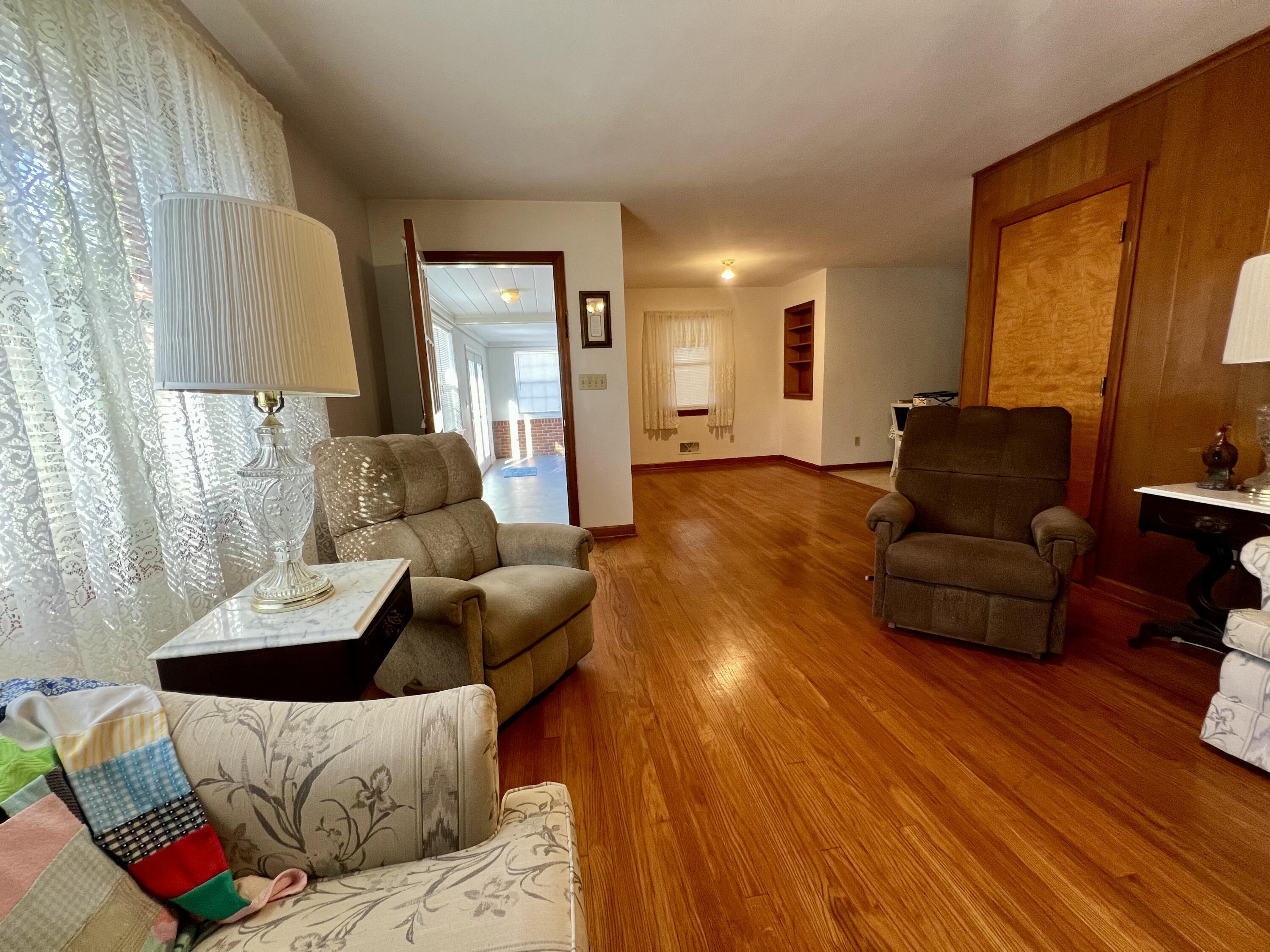 307 Virginia Mineral Springs Road New Castle, VA 24127 - Photo 23 of 45 a living room with furniture and a wooden floor