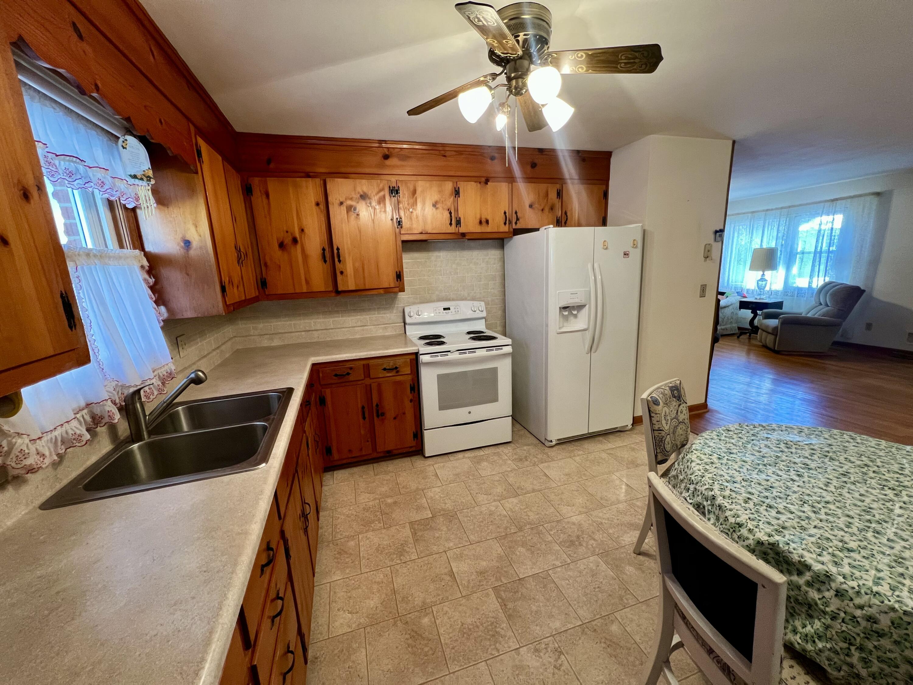 307 Virginia Mineral Springs Road New Castle, VA 24127 - Photo 9 of 45 a kitchen with granite countertop a stove and a refrigerator