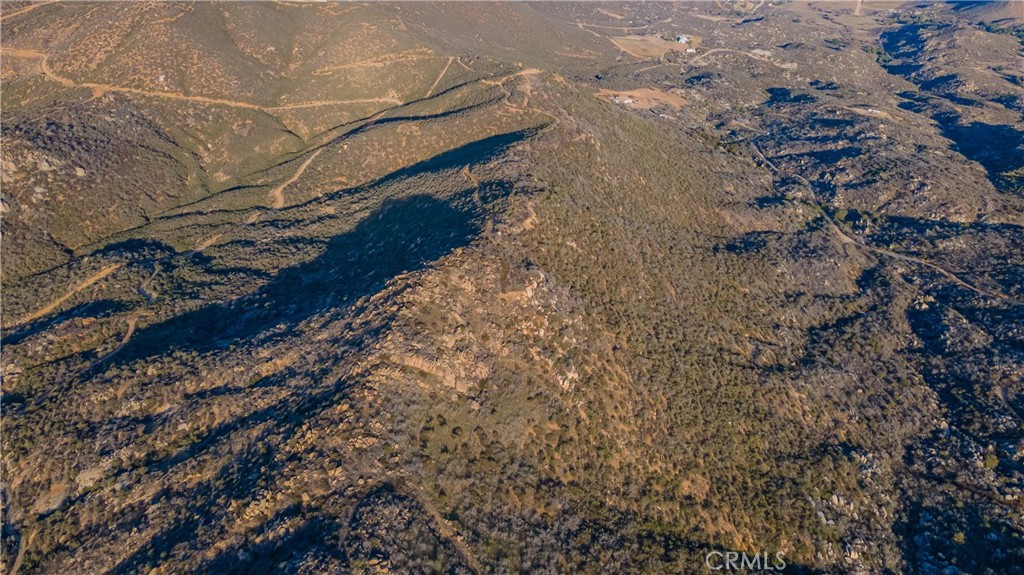 0 Lawghlin Road Hemet, CA 92543 - Photo 7 of 19 a view of a yard with wooden fence