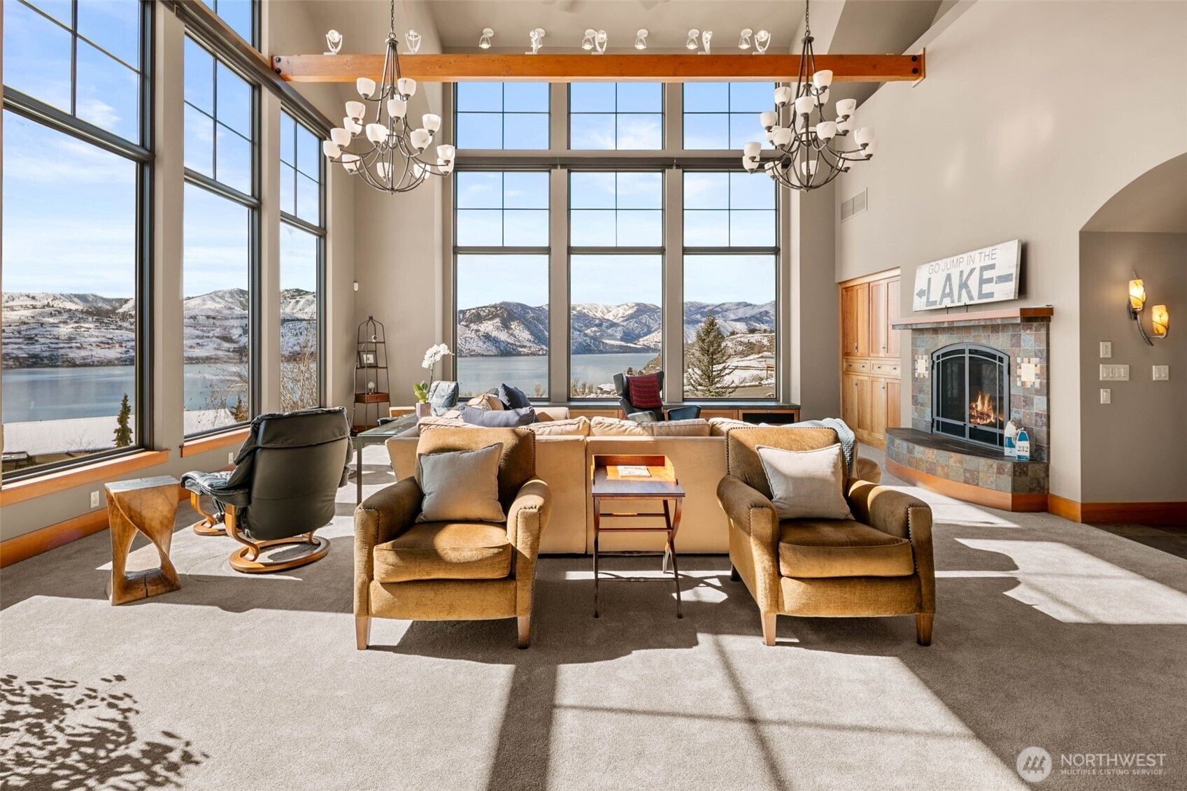 232 Crystal Drive Chelan, WA 98816 - Photo 3 of 39 a living room with furniture fireplace and a large window