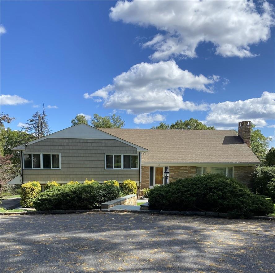 a view of a house with a garden