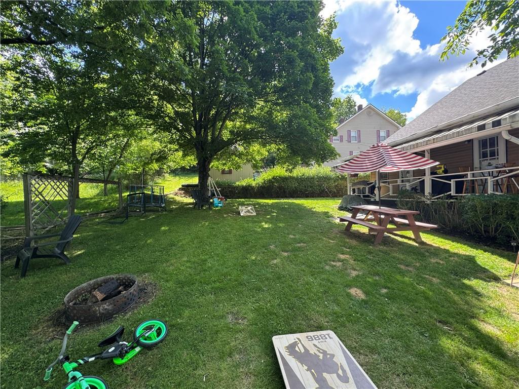 15-16 Ring Street Rural Ridge, PA 15075 - Photo 36 of 39 a backyard of a house with table and chairs