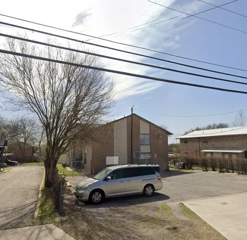 a car parked in front of a house