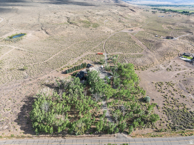 460 Omni Point Road Central Valley, UT 84754 - Photo 90 of 101 Expansive property featuring a residence with a dark roof and surrounding mature trees