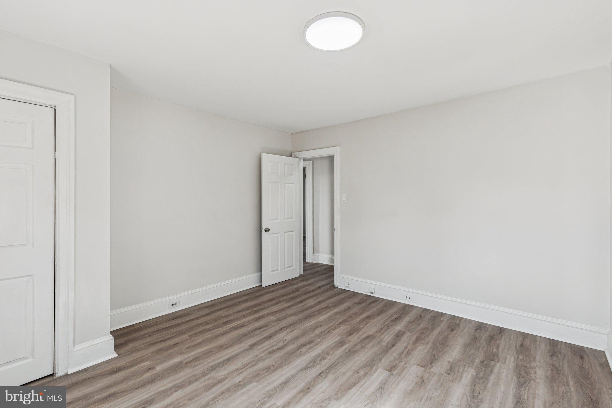 3408 Marshall Road Drexel Hill, PA 19026 - Photo 11 of 28 a view of an empty room and wooden floor
