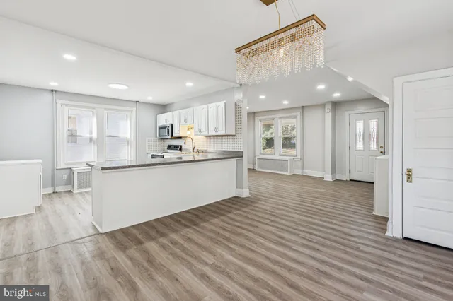 a view of kitchen with wooden floor