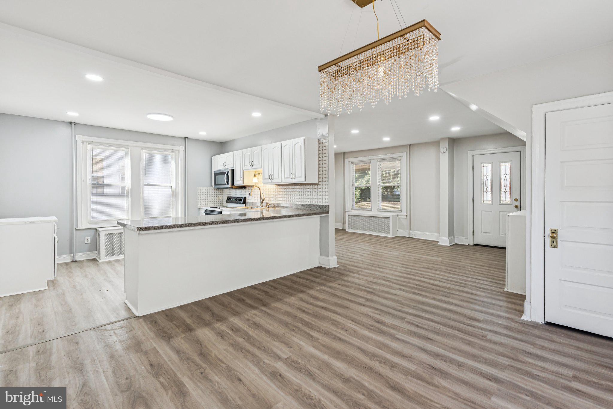 3408 Marshall Road Drexel Hill, PA 19026 - Photo 23 of 28 a large kitchen with stainless steel appliances granite countertop a large counter top and a refrigerator