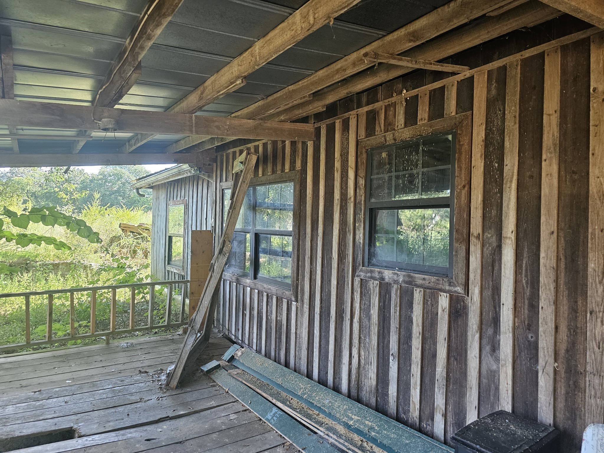 677 Howell Hill Road Flintville, TN 37335 - Photo 4 of 16 a view of deck with a floor to ceiling window and wooden floor