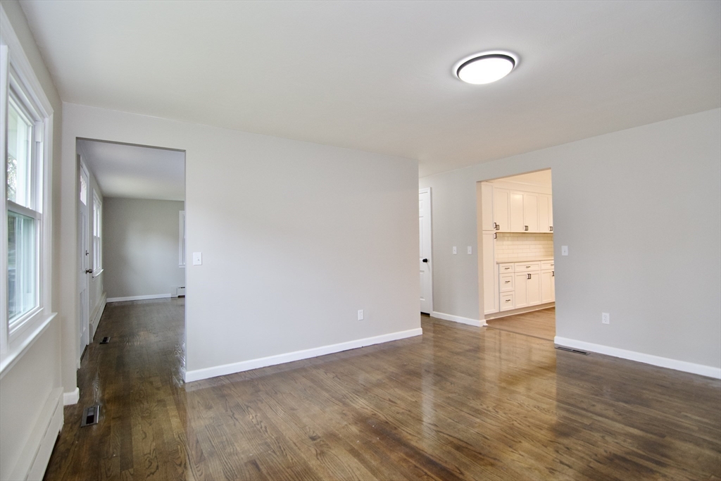 68 Sunrise Terrace Springfield, MA 01119 - Photo 11 of 42 an empty room with wooden floor and windows