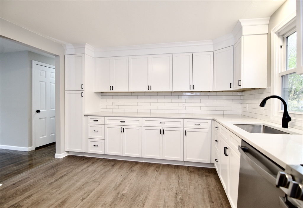 68 Sunrise Terrace Springfield, MA 01119 - Photo 15 of 42 a kitchen with granite countertop white cabinets and white appliances