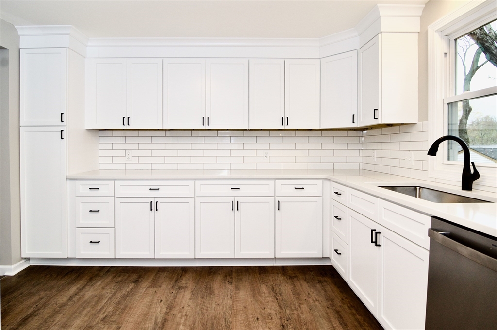 68 Sunrise Terrace Springfield, MA 01119 - Photo 16 of 42 a kitchen with white cabinets and sink