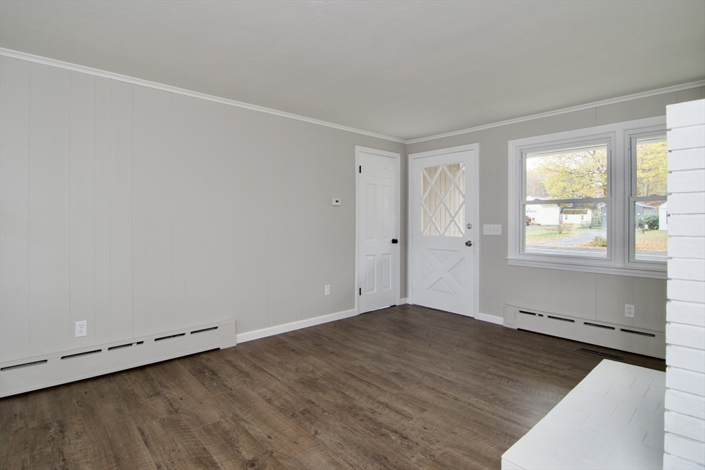 68 Sunrise Terrace Springfield, MA 01119 - Photo 19 of 42 an empty room with wooden floor and windows