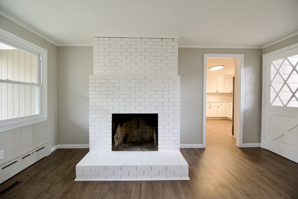 68 Sunrise Terrace Springfield, MA 01119 - Photo 21 of 42 a living room with wooden floor and a fireplace