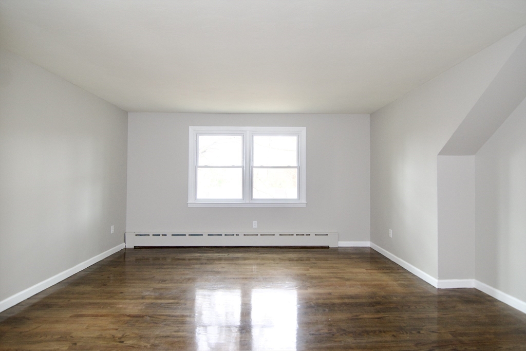 68 Sunrise Terrace Springfield, MA 01119 - Photo 28 of 42 a view of a room with wooden floor and a window