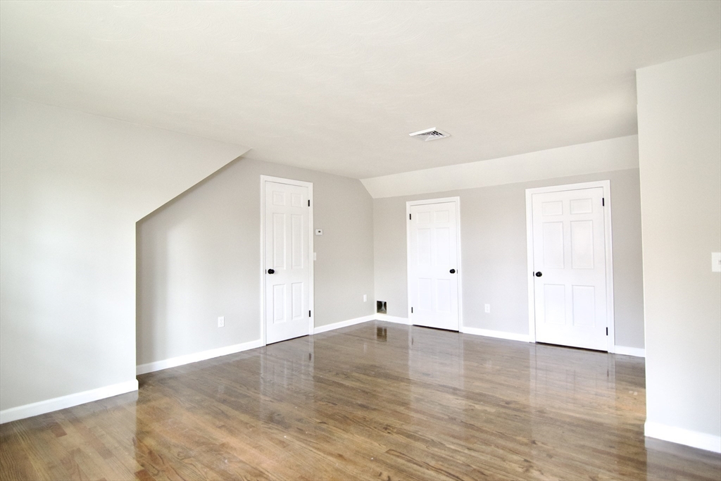 68 Sunrise Terrace Springfield, MA 01119 - Photo 29 of 42 a view of an empty room with wooden floor