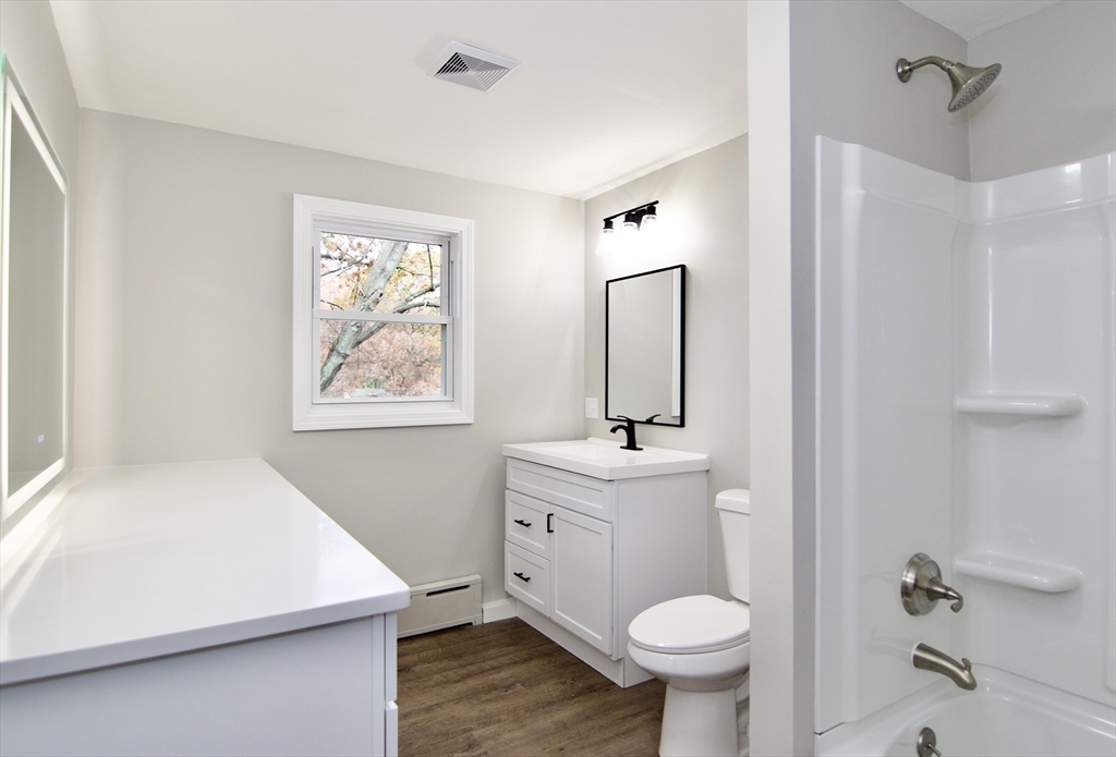 68 Sunrise Terrace Springfield, MA 01119 - Photo 33 of 42 a bathroom with a sink a toilet and a mirror