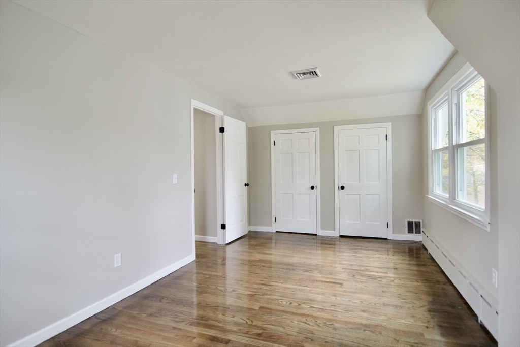 68 Sunrise Terrace Springfield, MA 01119 - Photo 36 of 42 a view of an empty room with wooden floor and window