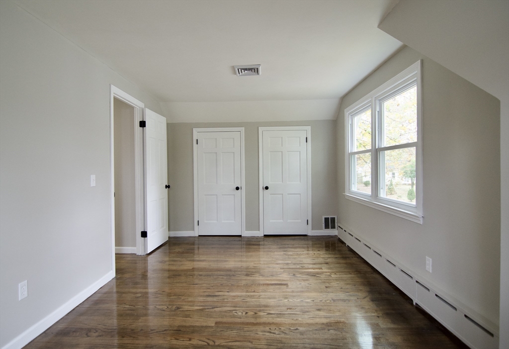 68 Sunrise Terrace Springfield, MA 01119 - Photo 38 of 42 a view of an empty room with wooden floor and a window