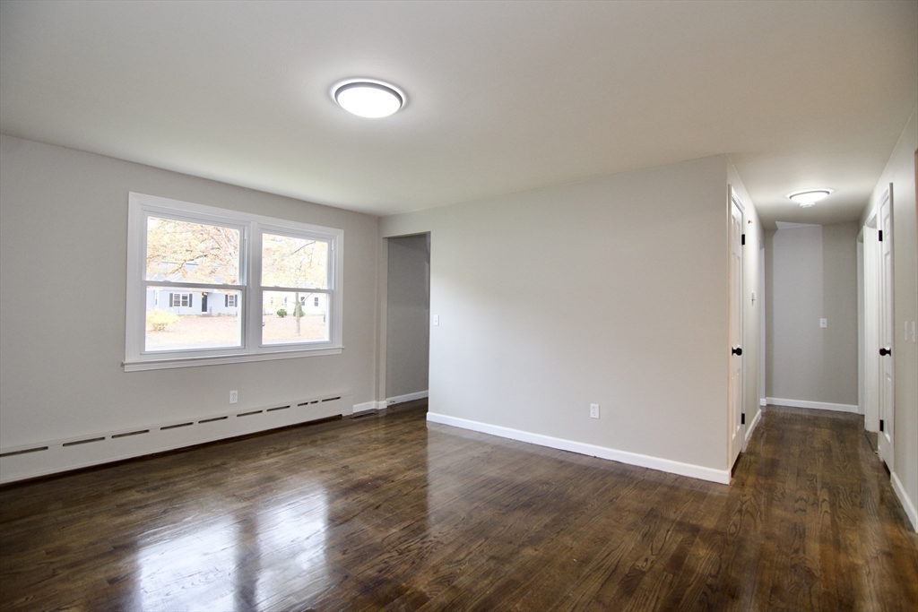 68 Sunrise Terrace Springfield, MA 01119 - Photo 9 of 42 an empty room with wooden floor and windows