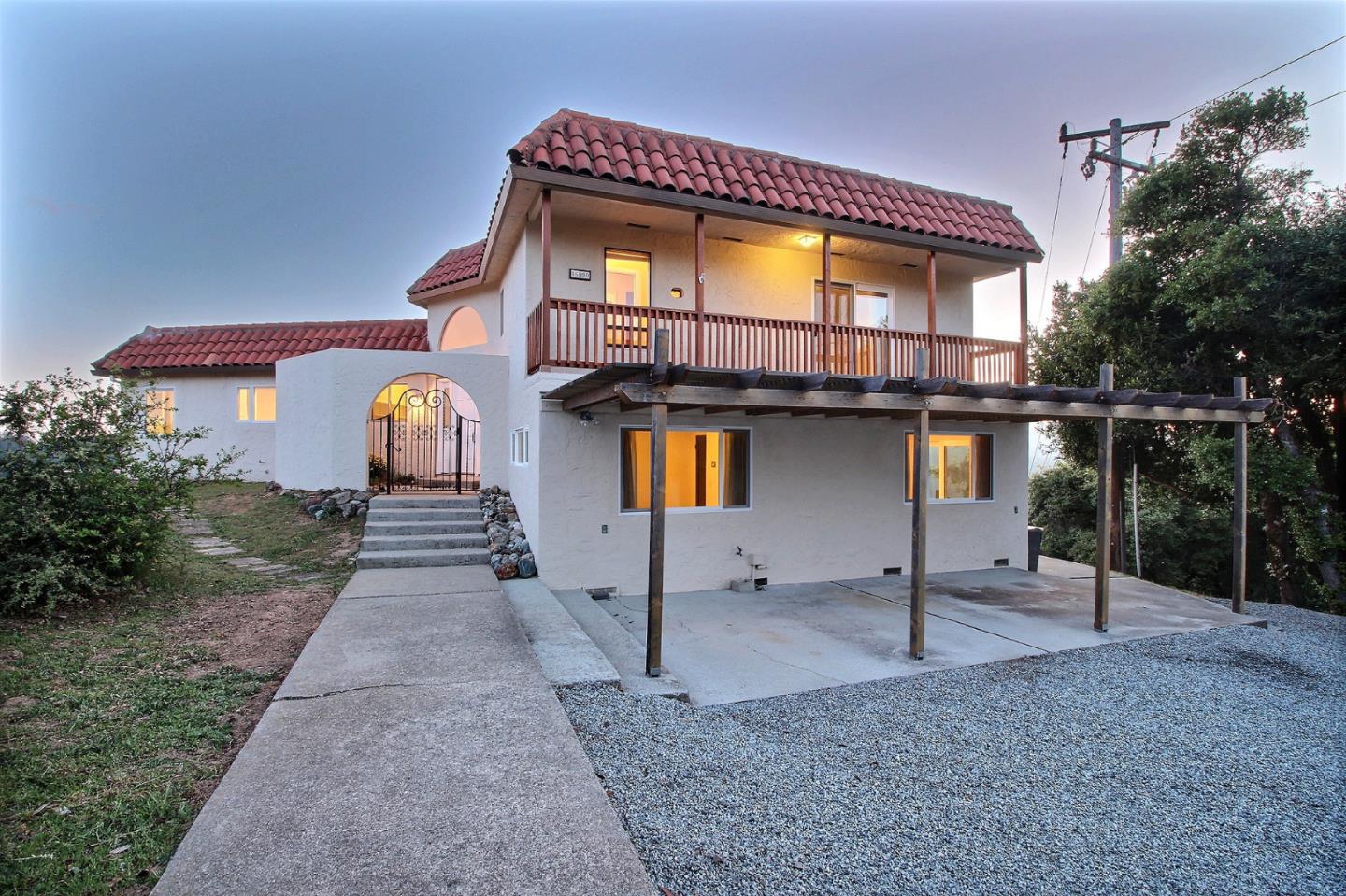 16999 McGill Road Saratoga, CA 95070 - Photo 1 of 41 a front view of a house with a yard