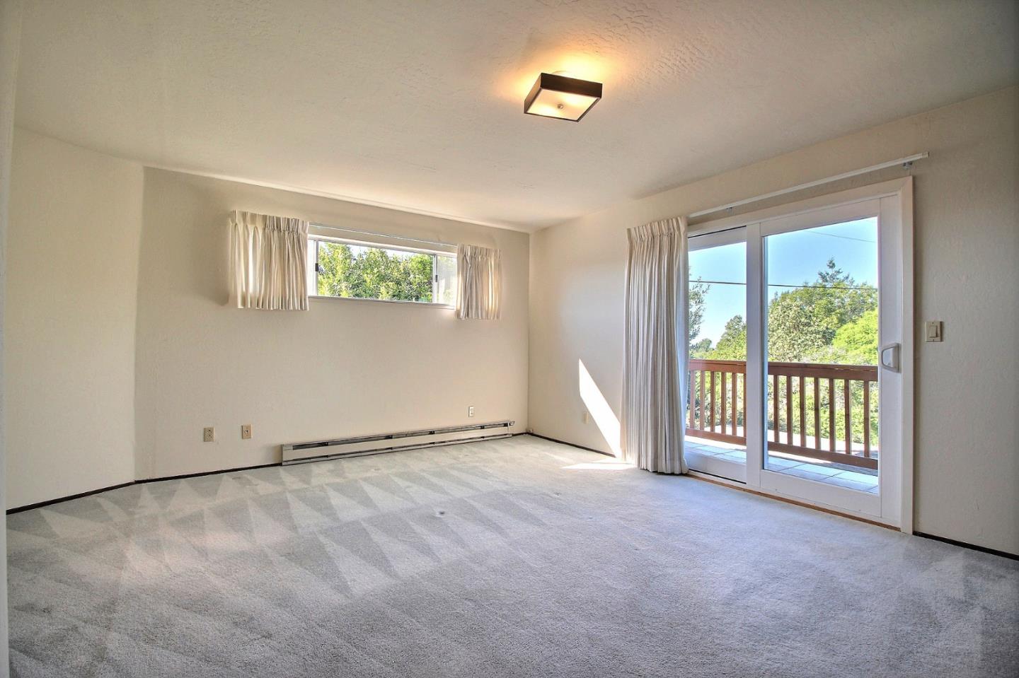 16999 McGill Road Saratoga, CA 95070 - Photo 19 of 41 an empty room with windows
