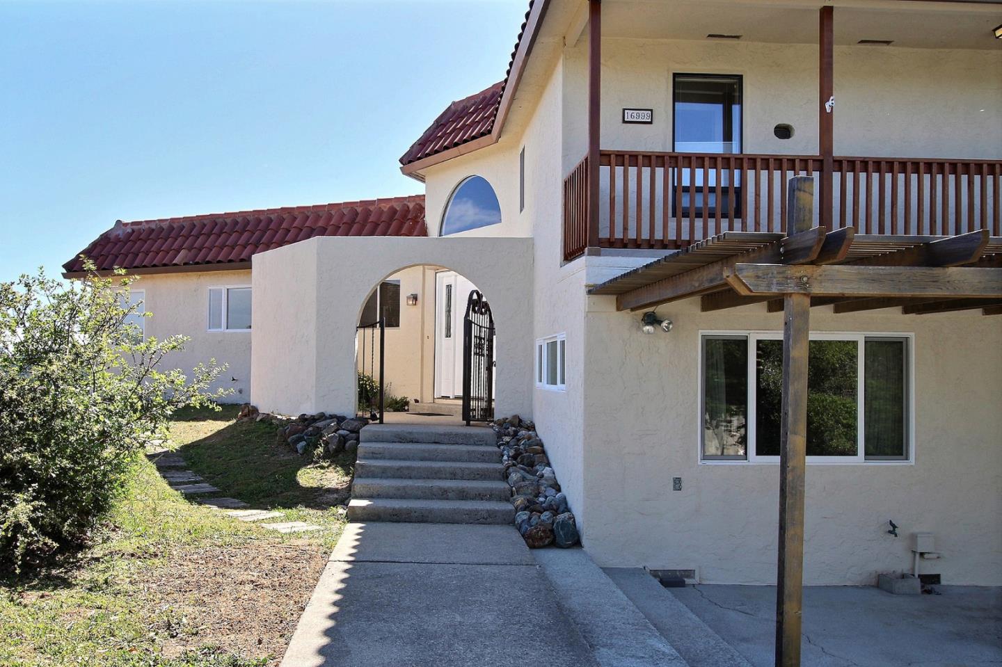 16999 McGill Road Saratoga, CA 95070 - Photo 2 of 41 a view of a house with a deck