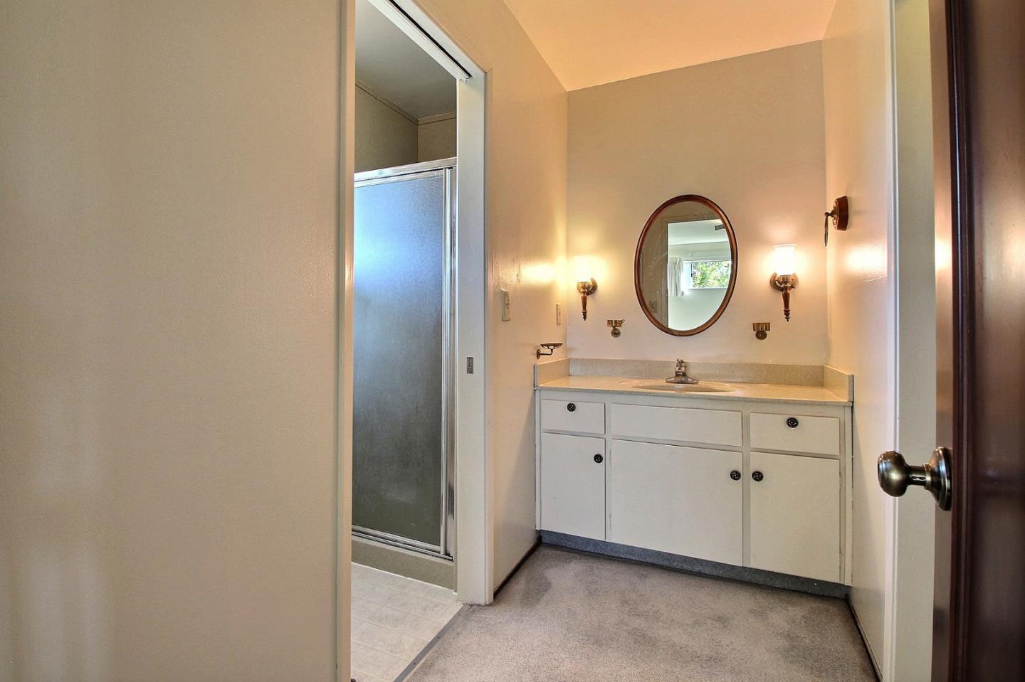 16999 McGill Road Saratoga, CA 95070 - Photo 22 of 41 a bathroom with a sink and a mirror