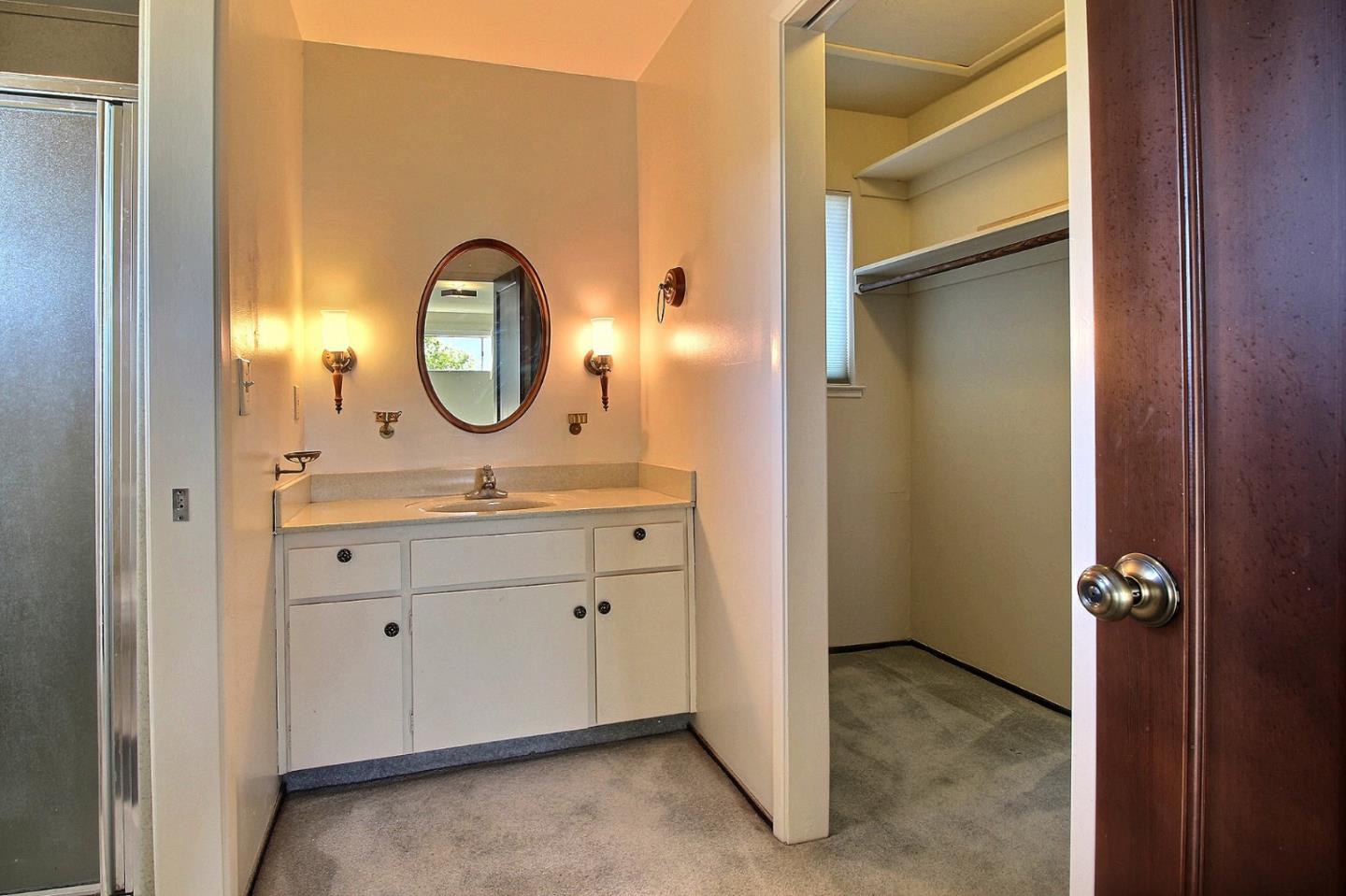 16999 McGill Road Saratoga, CA 95070 - Photo 23 of 41 a bathroom with a sink and a mirror