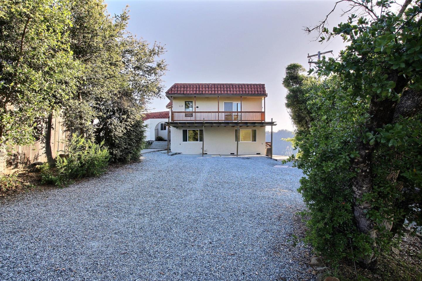 16999 McGill Road Saratoga, CA 95070 - Photo 3 of 41 a view of a house with a yard and tree s