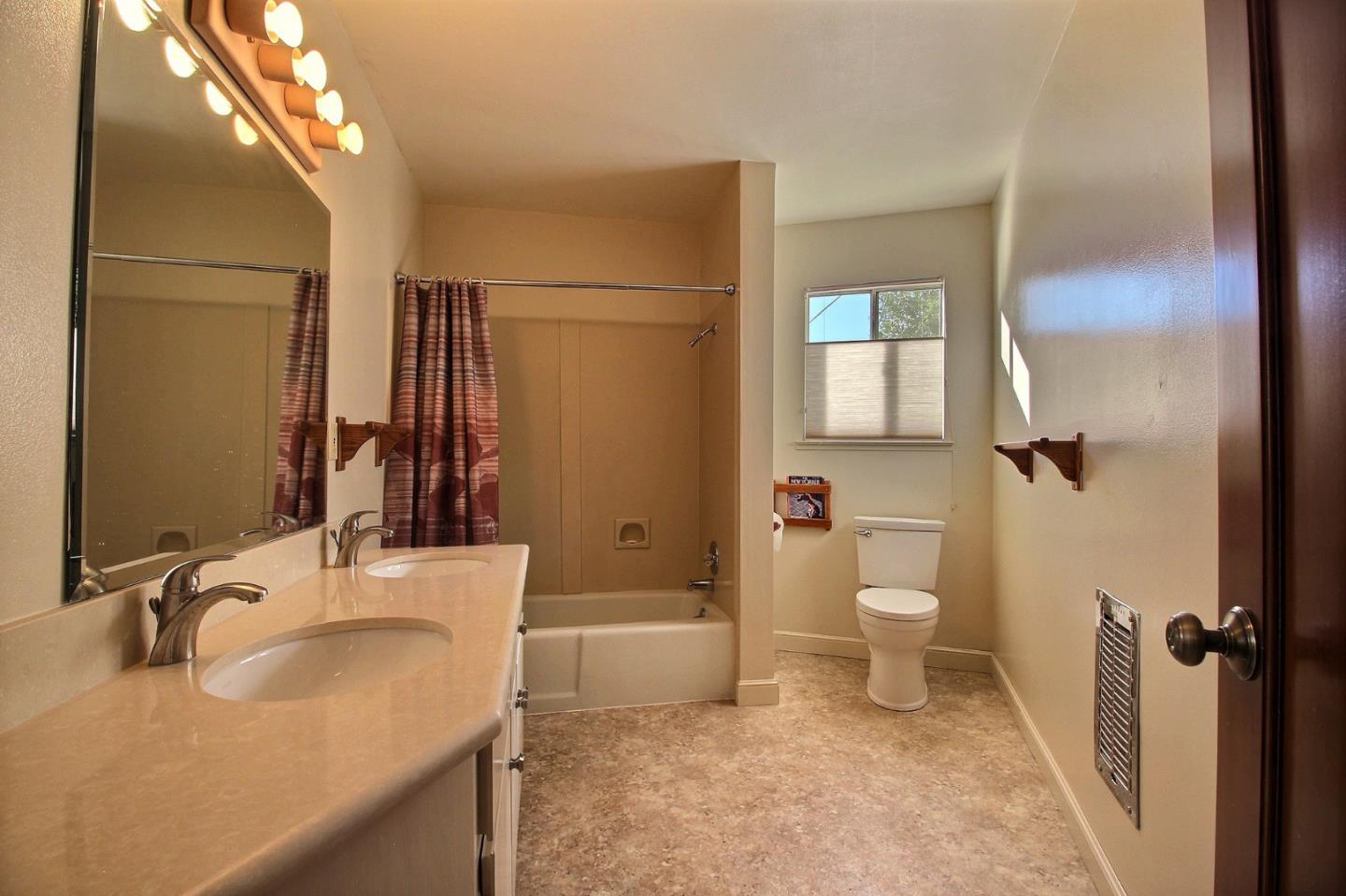 16999 McGill Road Saratoga, CA 95070 - Photo 32 of 41 a bathroom with a sink toilet and shower